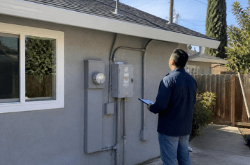 Nabu Energy technician evaluating a San Jose home for residential solar panel installation